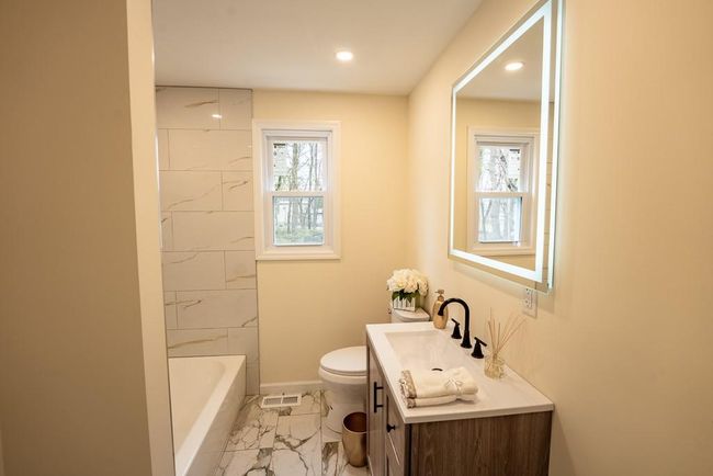 Full bathroom with vanity, recessed lighting, toilet, marble finish floor, and baseboards | Image 19