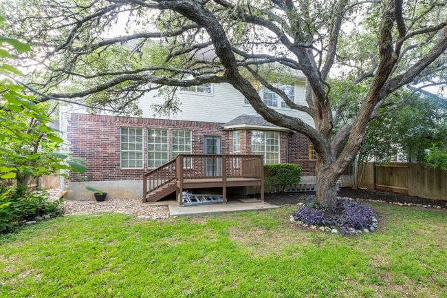 Rear view of house with brick siding and a deck | Image 34