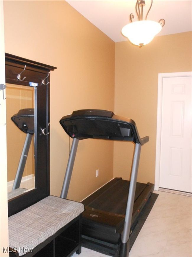 Mudroom area with exercise equipment | Image 35