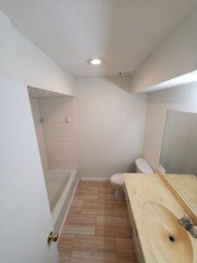Full bath featuring a shower, vanity, recessed lighting, and a tub to relax in | Image 13