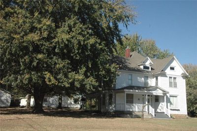 View of front facade featuring a porch | Image 1