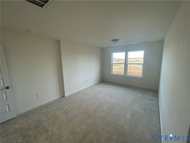 Spare room with light colored carpet and baseboards | Image 17
