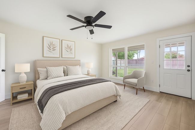 Bedroom featuring light wood-type flooring, ceiling fan, and access to exterior | Image 5