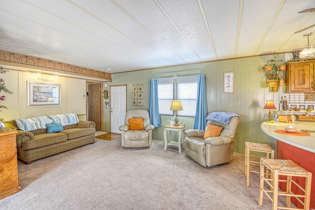 Living room featuring ornamental molding and carpet flooring | Image 18
