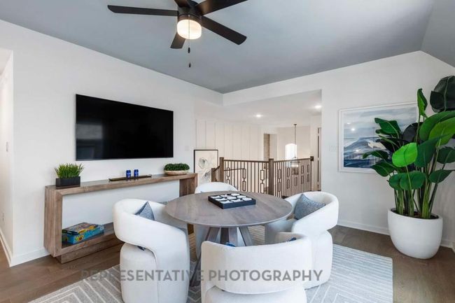 Living room featuring wood finished floors and ceiling fan | Image 33