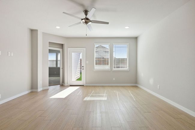Unfurnished room featuring ceiling fan, light wood finished floors, baseboards, and recessed lighting | Image 9