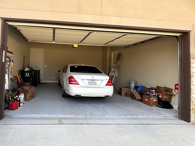 2 car garage, with Insulated garage door, and extra lighting. | Image 36
