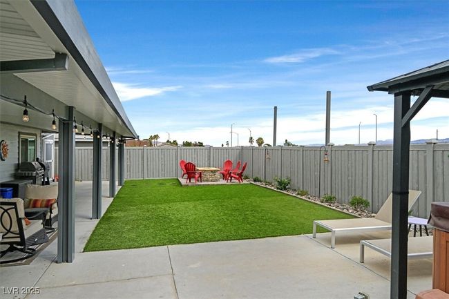 View of yard with a patio, a fenced backyard, and an outdoor fire pit | Image 29