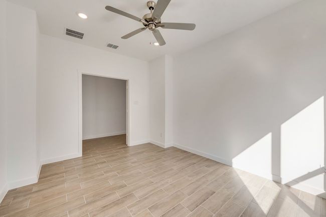 Empty room featuring a ceiling fan, light wood-type flooring, and recessed lighting | Image 5