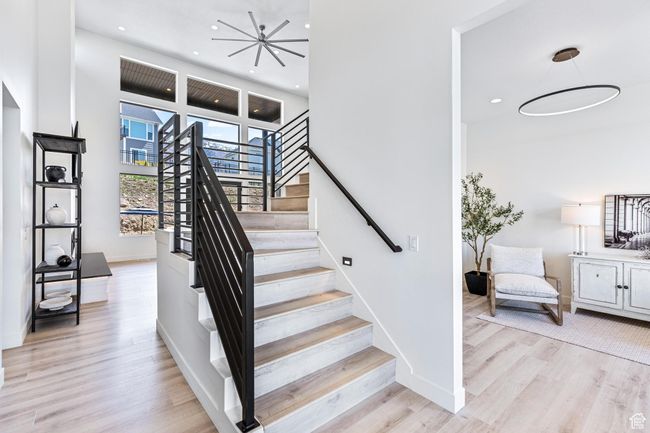 Stairs with baseboards, recessed lighting, and wood finished floors | Image 11