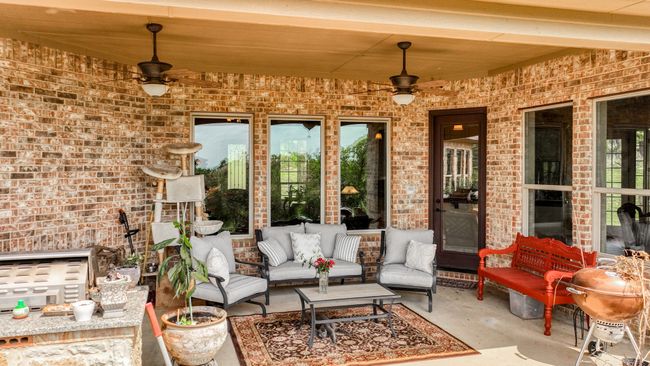 View of patio / terrace featuring outdoor lounge area and a ceiling fan | Image 35