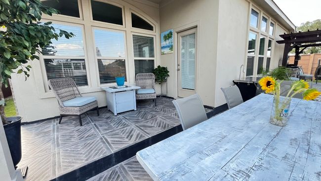 View of patio with outdoor dining space and a pergola | Image 36