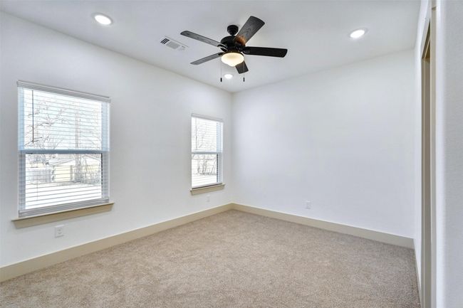 Carpeted spare room with ceiling fan, baseboards, visible vents, and recessed lighting | Image 15