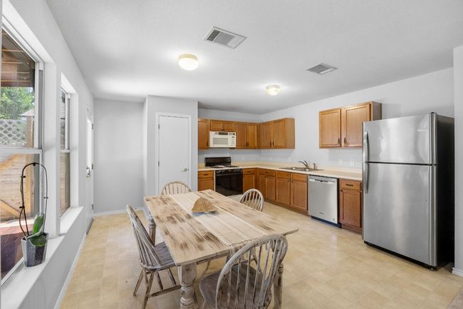 Enjoy meals indoors or step outside and dine under the covered deck. | Image 9