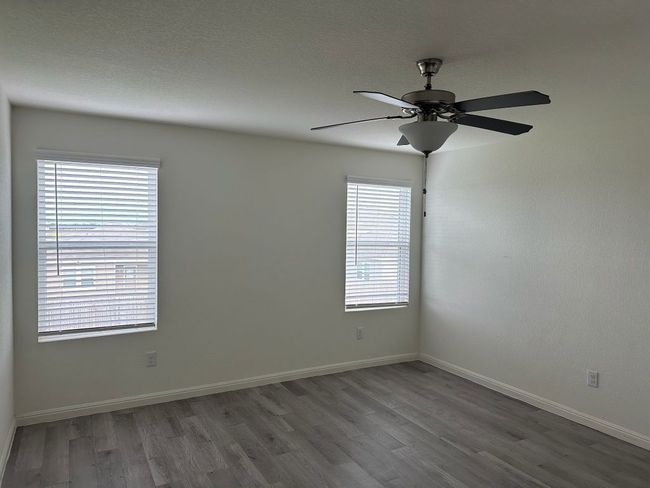 Spare room with wood finished floors and ceiling fan | Image 16