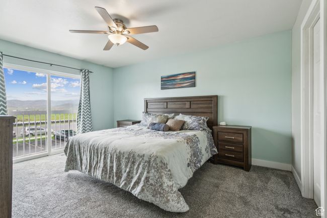 Carpeted bedroom featuring access to exterior, baseboards, and a ceiling fan | Image 7