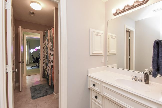 Come on in to your Jack and Jill bathroom, one sink and vanity area has plenty of cabinet and countertop space for all of your toiletries. | Image 22