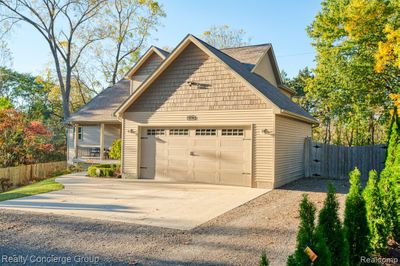 Ample driveway parking & 2.5 car garage | Image 3