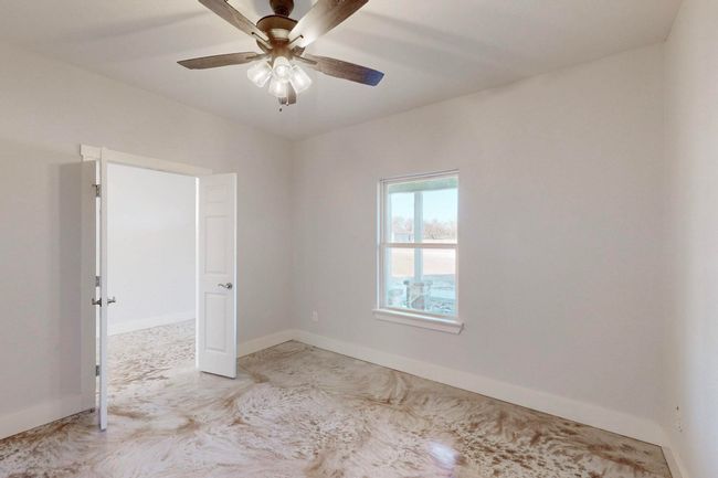Empty room featuring baseboards and ceiling fan | Image 36