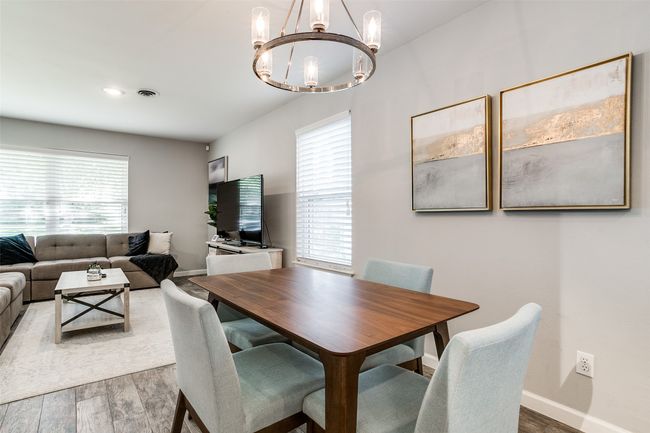 Dining room featuring a chandelier, and wood finished floors | Image 7