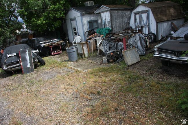 View of yard with a shed and an outdoor structure | Image 26