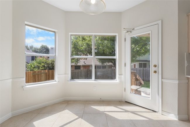 Unfurnished sunroom with plenty of natural light | Image 12