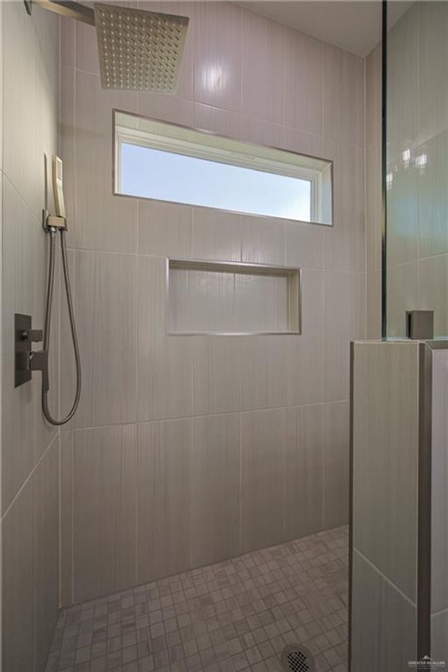Bathroom featuring a shower | Image 9