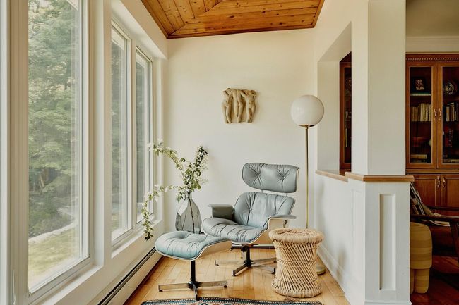 Sitting room with wood ceiling, lofted ceiling, a baseboard radiator, and light wood-type flooring | Image 12