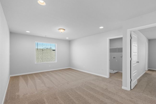 Unfurnished bedroom with carpet, recessed lighting, and a walk in closet | Image 20