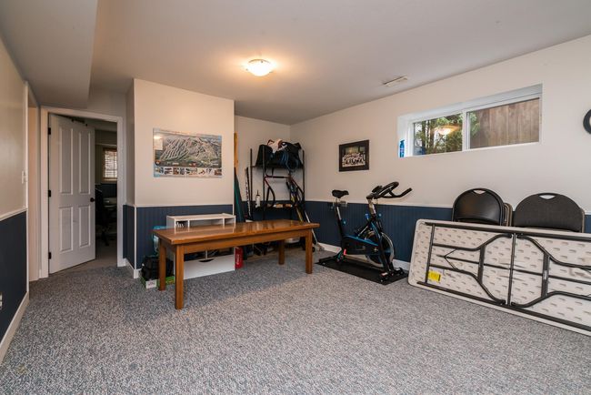 Office with carpet, visible vents, and wainscoting | Image 21