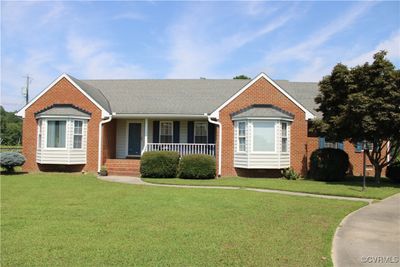 View of front of home featuring covered porch and a front lawn | Image 3