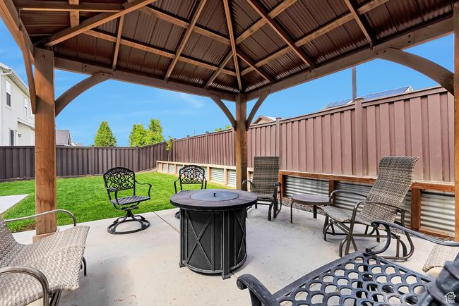 View of patio featuring a gazebo and a fire pit | Image 30