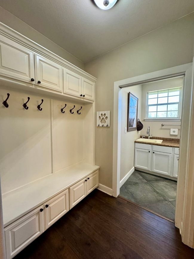 Mudroom with baseboards, a sink, and dark wood finished floors | Image 12