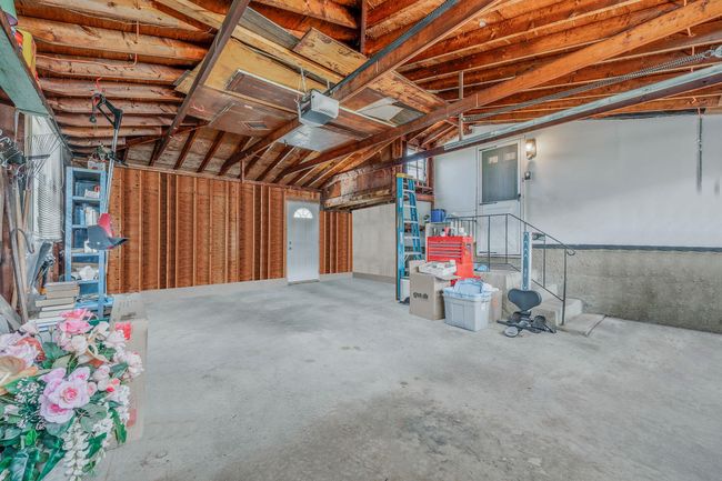 Garage with a garage door opener | Image 25