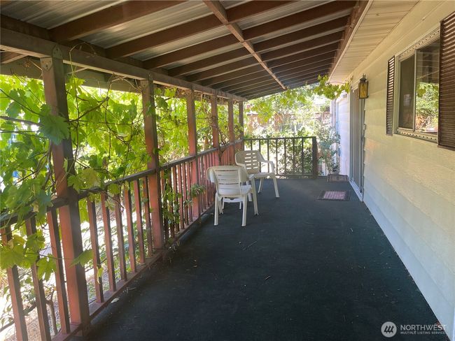 Covered porch and deck attached to the home | Image 19