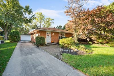 Single story home with a front yard and a 2 car garage | Image 2