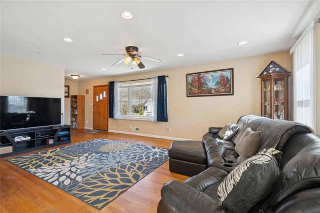 Living area with recessed lighting, a ceiling fan, and wood finished floors | Image 13