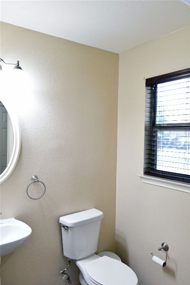 Half bathroom with a sink and toilet | Image 7