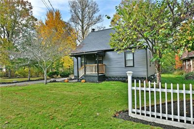 Bungalow featuring a front yard and covered porch | Image 3