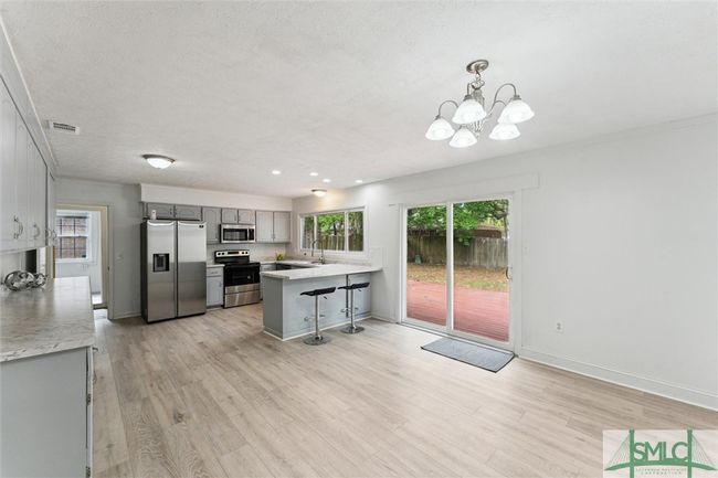 Dining / Kitchen Combo with Breakfast Bar | Image 9