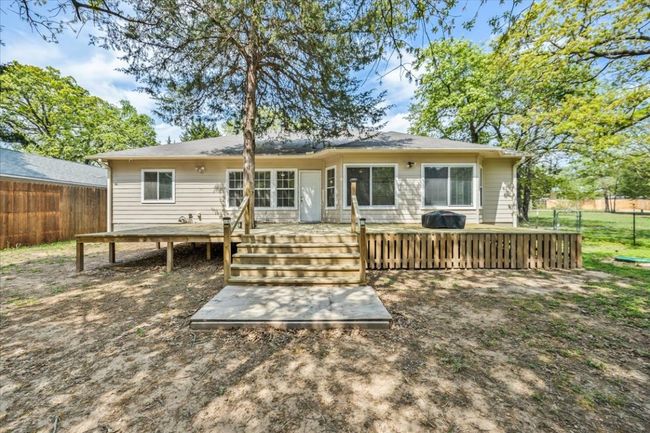 Back of house with a wooden deck and fence | Image 23