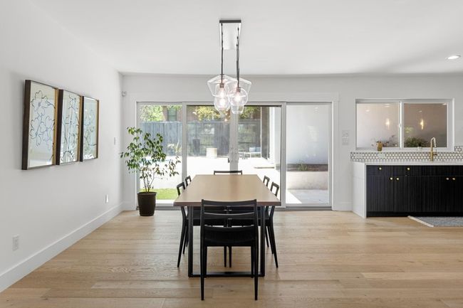 Dining space featuring baseboards, light wood finished floors, and recessed lighting | Image 6