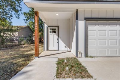 View of exterior entry with a garage | Image 2