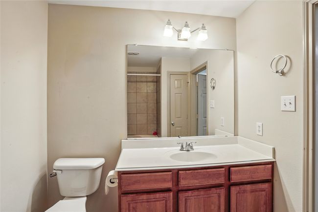 Full bathroom featuring toilet and vanity | Image 25