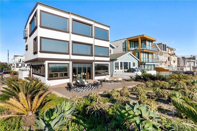 This extraordinary statement home sits on a premier and oversized 40 foot wide, beachfront, corner lot! | Image 5