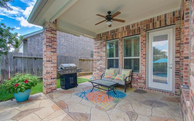 Covered back patio off the kitchen/family room. | Image 47