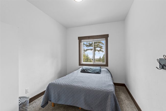 Bedroom with carpet floors and baseboards | Image 33