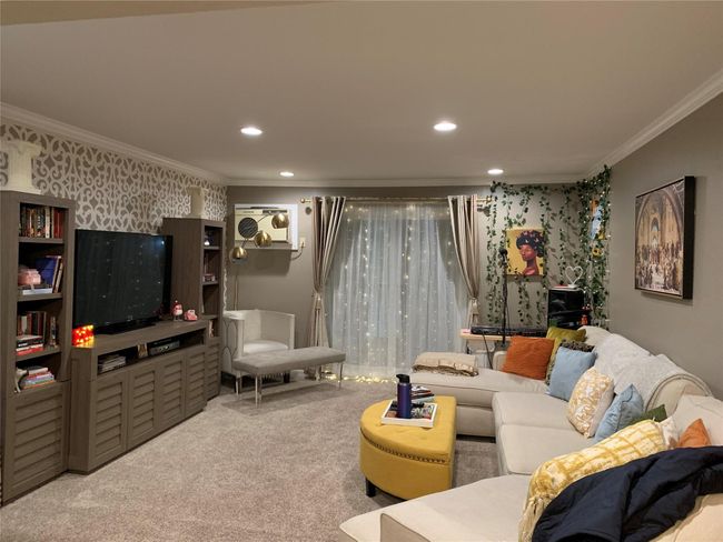 Carpeted living room with crown molding and recessed lighting | Image 5