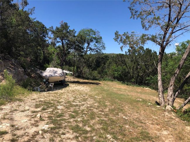 View of yard with a wooded view | Image 4
