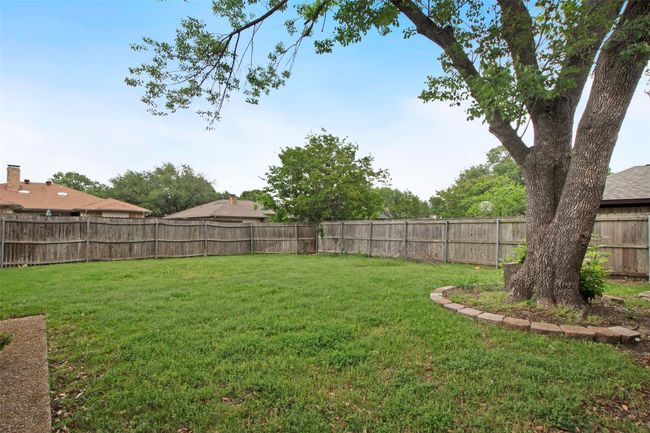 View of yard with a fenced backyard | Image 16